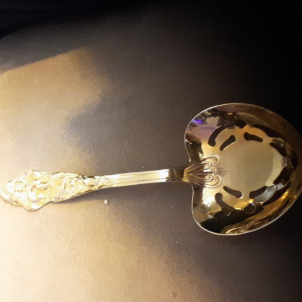 Vintage gold plated reticulated serving spoon